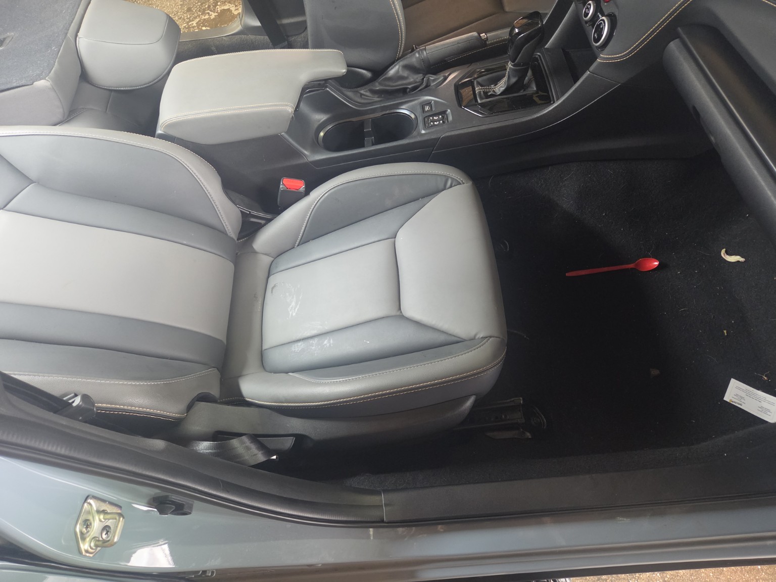 Dirty Subaru front interior before detailing